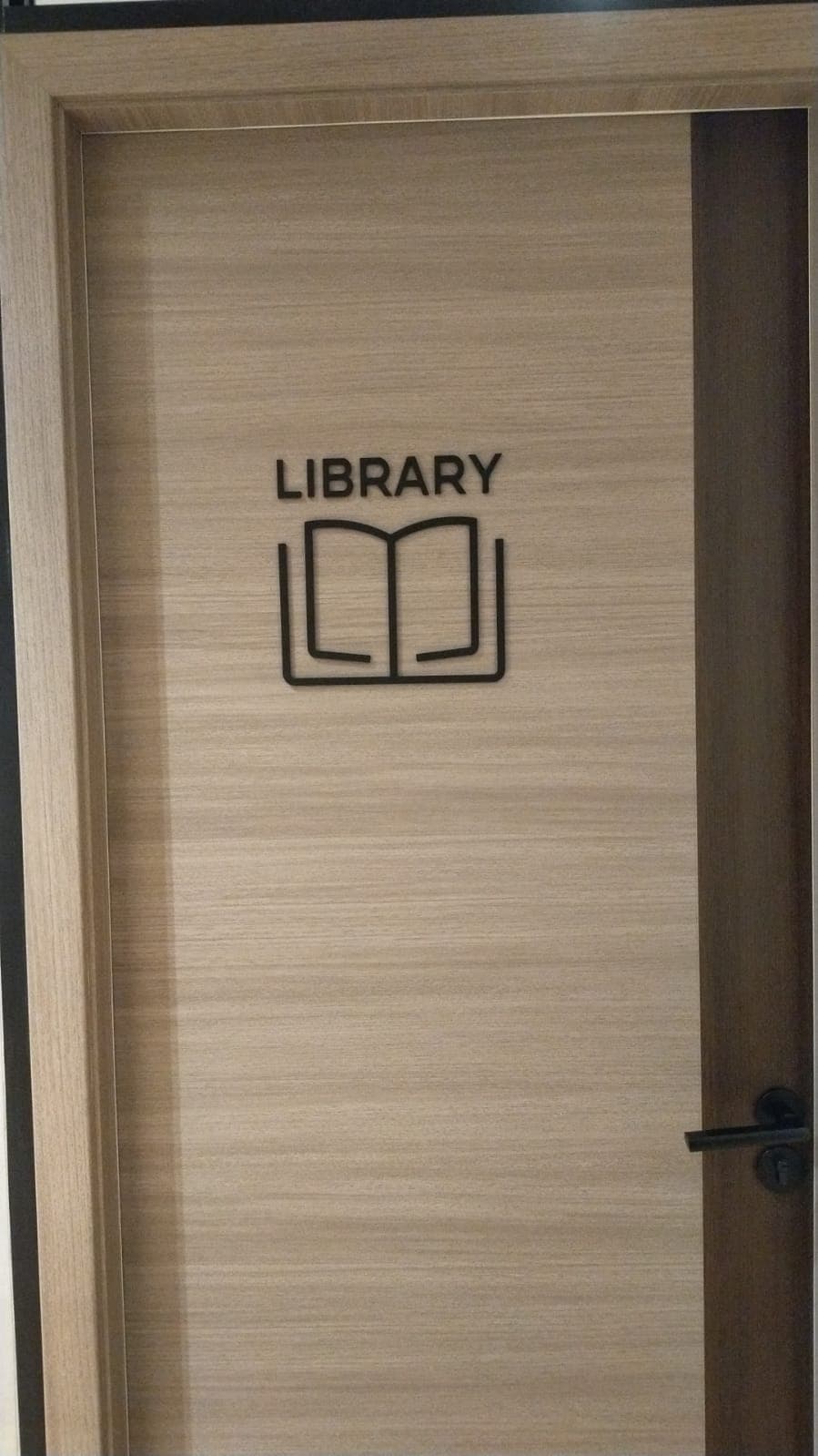 Library door with laser-cut acrylic sign