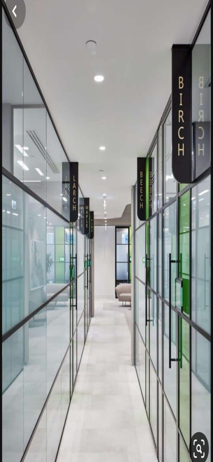 Office corridor with hanging wayfinding signs