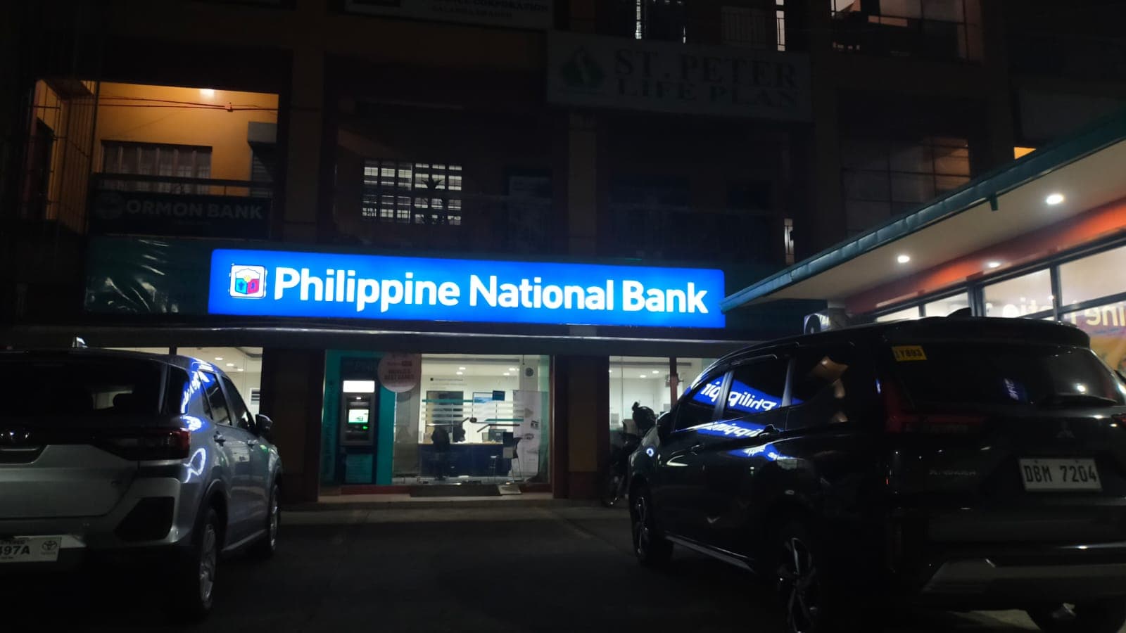 Philippine National Bank illuminated fascia sign at night