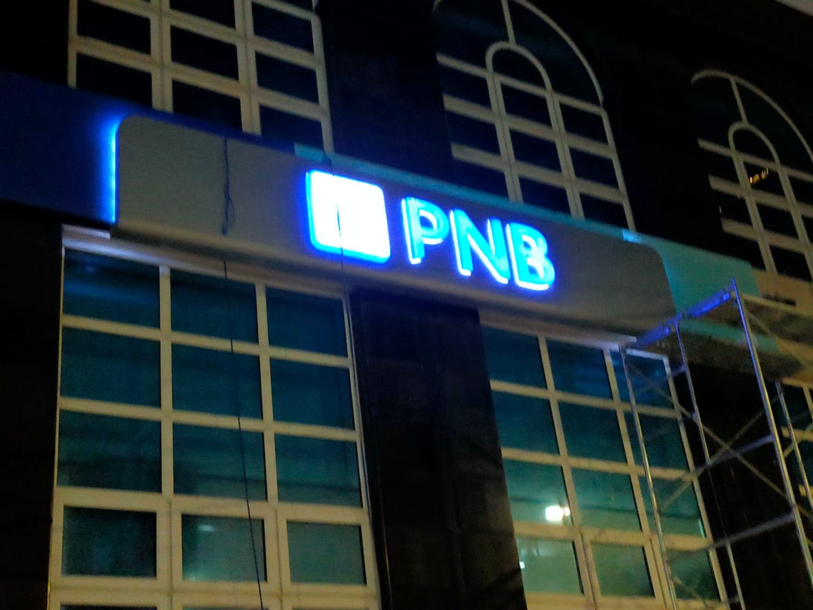 PNB neon sign on commercial building exterior