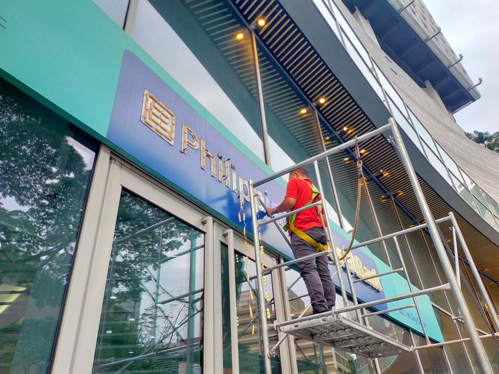 Philippine Savings Bank facade sign installation in progress