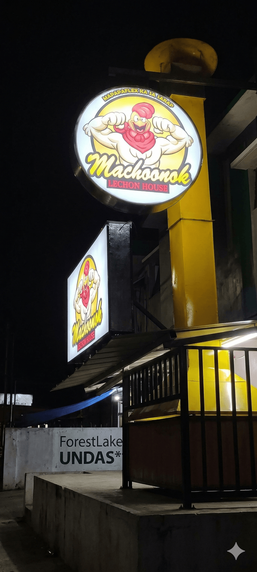 Branded store front sign installed above a retail shop entrance