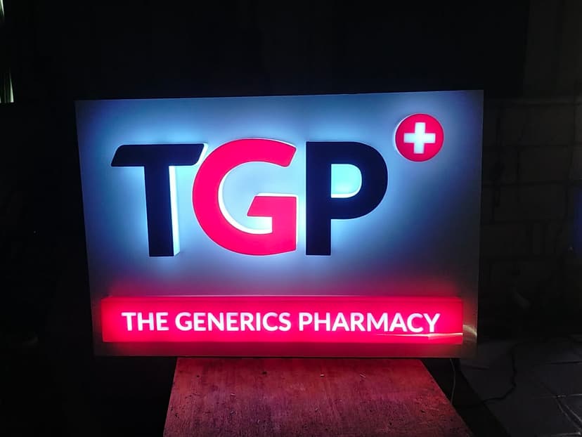Illuminated build-up signage with raised 3D letters and backlit panel for The Generics Pharmacy