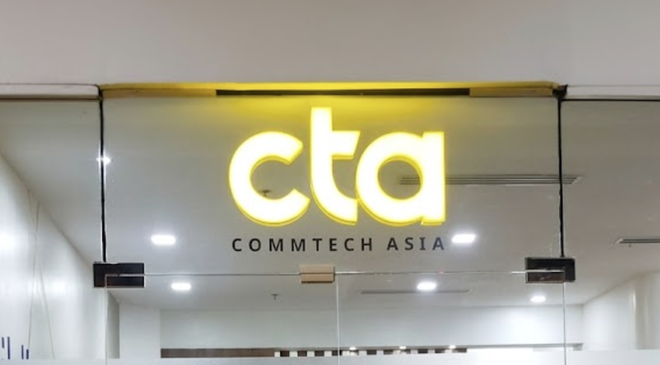 Glowing neon and LED shop signs on a bustling city street at night